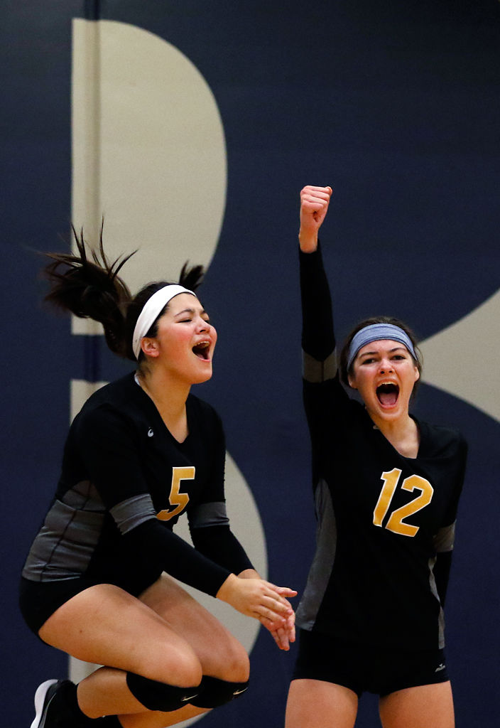 Club CoMo's Maddie Llewellyn and Ketti Horton cheer their team on
